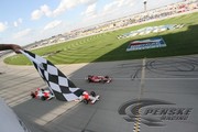 Helio Castroneves and Ryan Briscoe finish first and third at Chicagoland